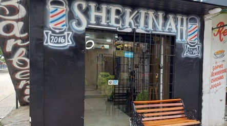 Entrance of Shekinah Barber Shop, Barranquilla, Atlántico, CO, showing modern signage and street view.