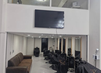 Modern interior of Kings Blade Barbershop in Randburg, Gauteng, ZA with sleek seating and styling stations.