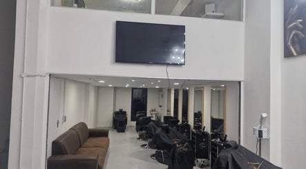 Modern interior of Kings Blade Barbershop in Randburg, Gauteng, ZA with sleek seating and styling stations.