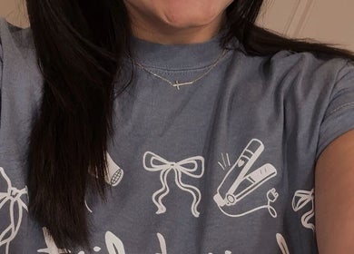 Smiling staff in branded tee at Premier Salon - Bonner Springs, Bonner Springs, Kansas, US.