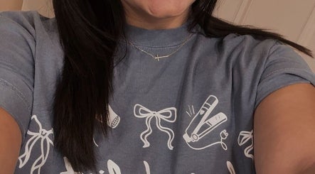 Smiling staff in branded tee at Premier Salon - Bonner Springs, Bonner Springs, Kansas, US.