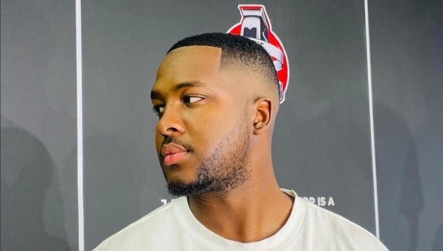 Client showcasing a fresh fade haircut at Joes Fade Cuts Grooming, Windhoek, Khomas Region, NA.