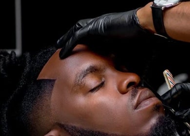 Barber expertly trims a client's hair at Joes Fade Cuts Grooming, Windhoek, Khomas Region, NA.