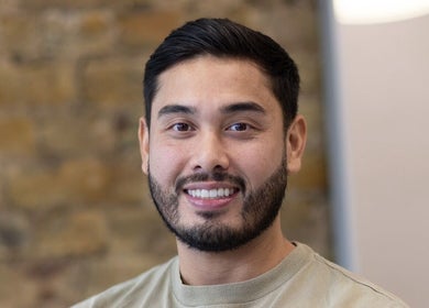 Friendly barber at Barber Nick.LS, Twickenham, England, GB, showcasing welcoming ambiance.