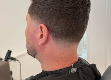 Crisp fade haircut at Barber Nick.LS in Twickenham, England, GB.