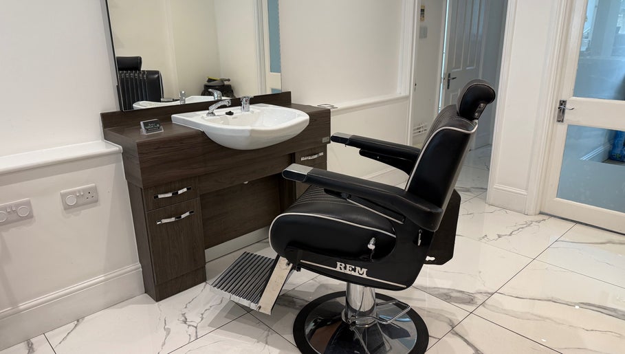 Sophisticated barber chair and sink at Barber Nick.LS, Twickenham, England, GB.