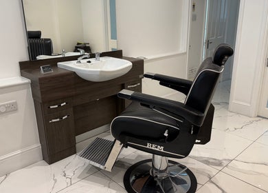 Sophisticated barber chair and sink at Barber Nick.LS, Twickenham, England, GB.