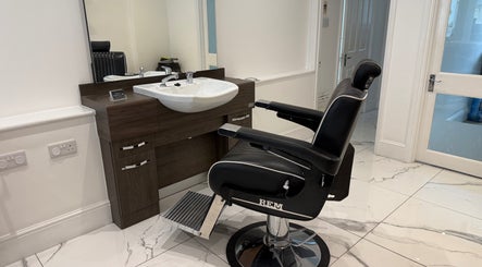 Sophisticated barber chair and sink at Barber Nick.LS, Twickenham, England, GB.