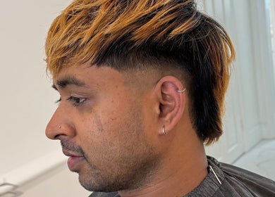 Profile view of a stylish mullet haircut at Barber Nick.LS in Twickenham, England, GB.