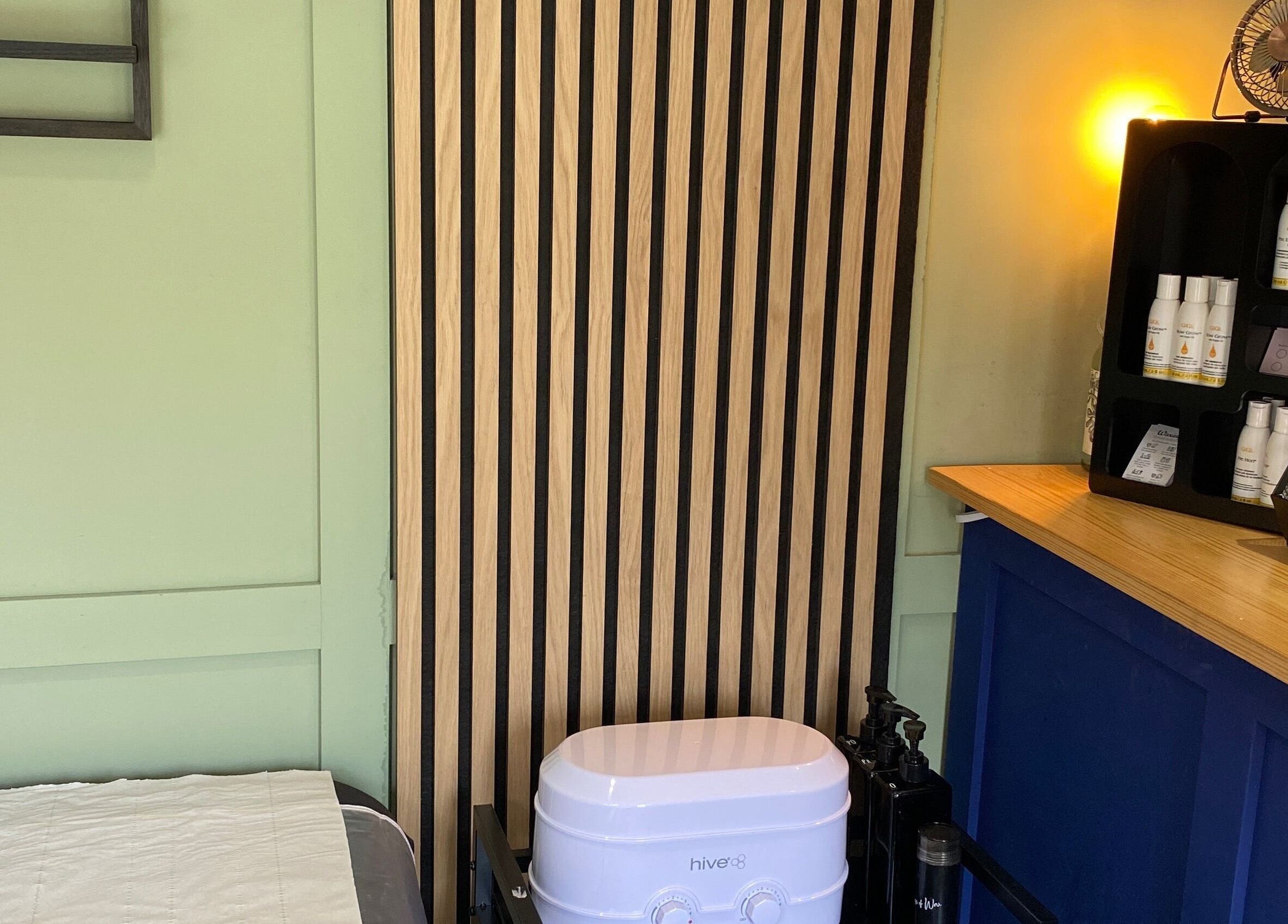 Inviting interior of House of Wax | Waxing Salon in St Helens, England, GB, showcasing a treatment area.