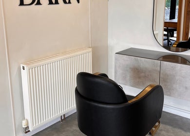 Modern salon chair and mirror at AlexandraJaine Extensions in Tickenham, England, GB.