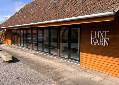 Exterior of Luxe Barn at AlexandraJaine Extensions, Tickenham, England, GB offering beauty and wellness services.