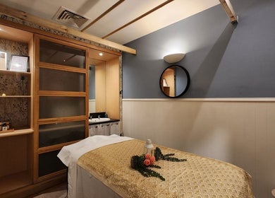 Tranquil massage room at Thai Wellbeing Massage, Maidstone, England, GB with a treatment table and decor.