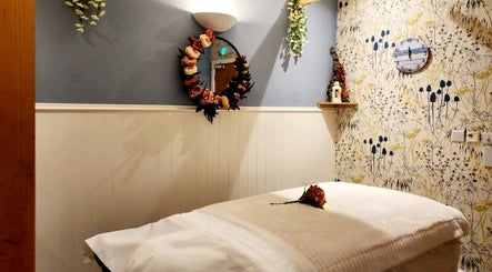Calm massage room at Thai Wellbeing Massage, Maidstone, England, GB, with cozy decor and soothing ambiance.