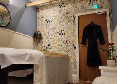 Tranquil massage room at Thai Wellbeing Massage in Maidstone, England, GB with soothing decor and soft lighting.
