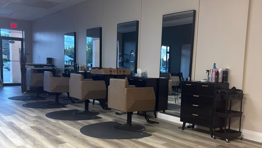 Salon interior at Locks By Liv, St. Catharines, Ontario, CA with modern styling chairs and mirrors.