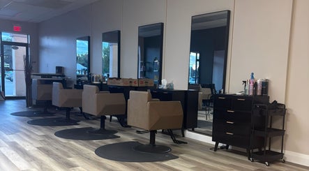 Salon interior at Locks By Liv, St. Catharines, Ontario, CA with modern styling chairs and mirrors.