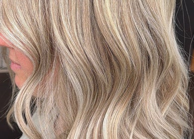 Blonde hair with soft curls styled at Locks By Liv, St. Catharines, Ontario, CA.