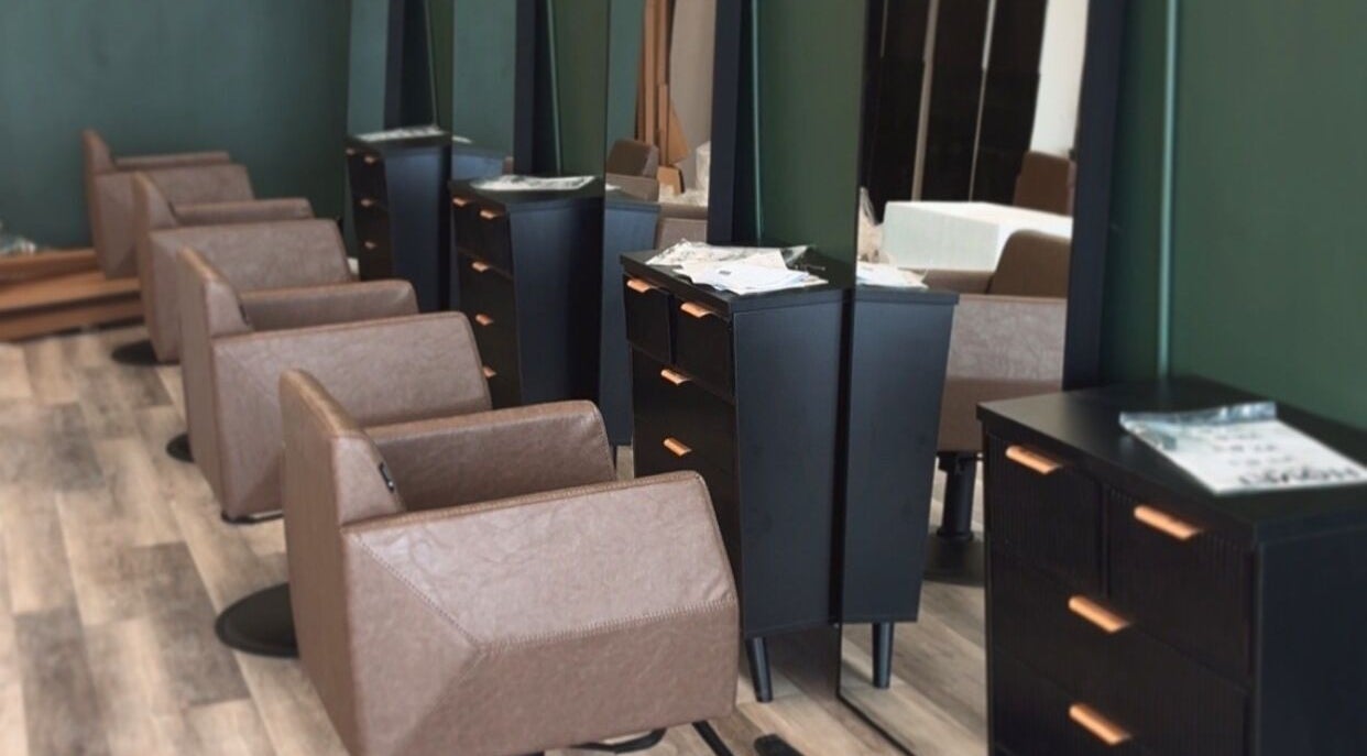 Modern salon interior at Locks By Liv in St. Catharines, Ontario, CA with elegant styling stations.