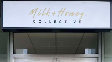 Entrance sign of Milk and Honey Collective in Kerikeri, Northland Region, NZ, showcasing elegant branding.