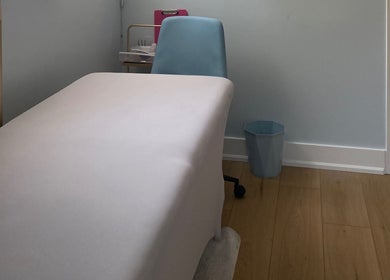 Cozy treatment room at Paradise Glamour Lounge INC., St. Catharines, Ontario, CA, with a comfortable massage table.