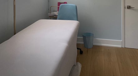 Cozy treatment room at Paradise Glamour Lounge INC., St. Catharines, Ontario, CA, with a comfortable massage table.