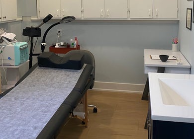 Modern treatment room at Paradise Glamour Lounge INC., St. Catharines, Ontario, CA, showcasing a relaxing ambiance.