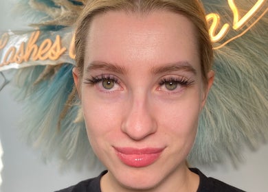 Woman showcasing glamorous eyelashes at Paradise Glamour Lounge INC., St. Catharines, Ontario, CA.
