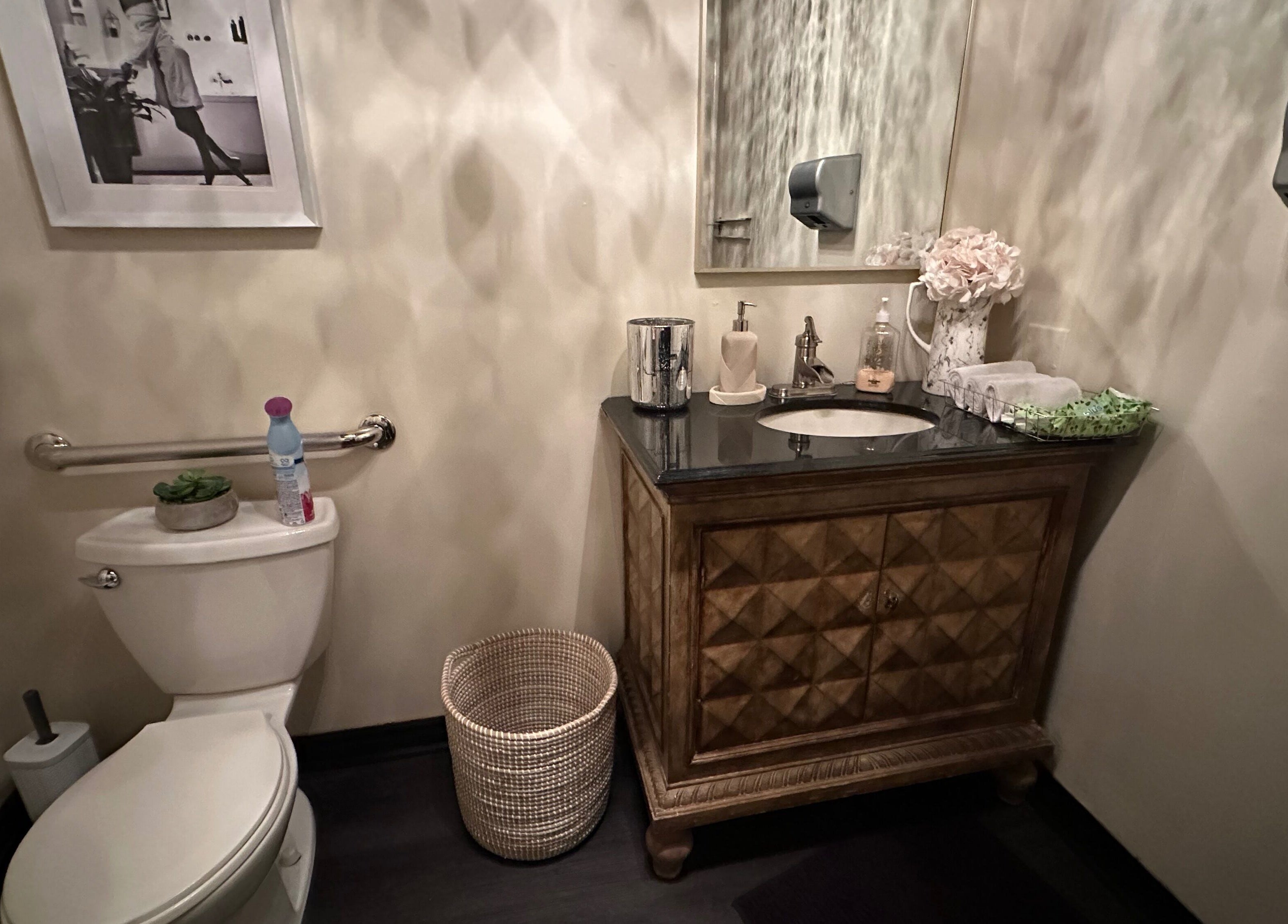 Elegant restroom at Madly In Lashed, Hamilton, Ontario, CA, featuring stylish decor and modern amenities.