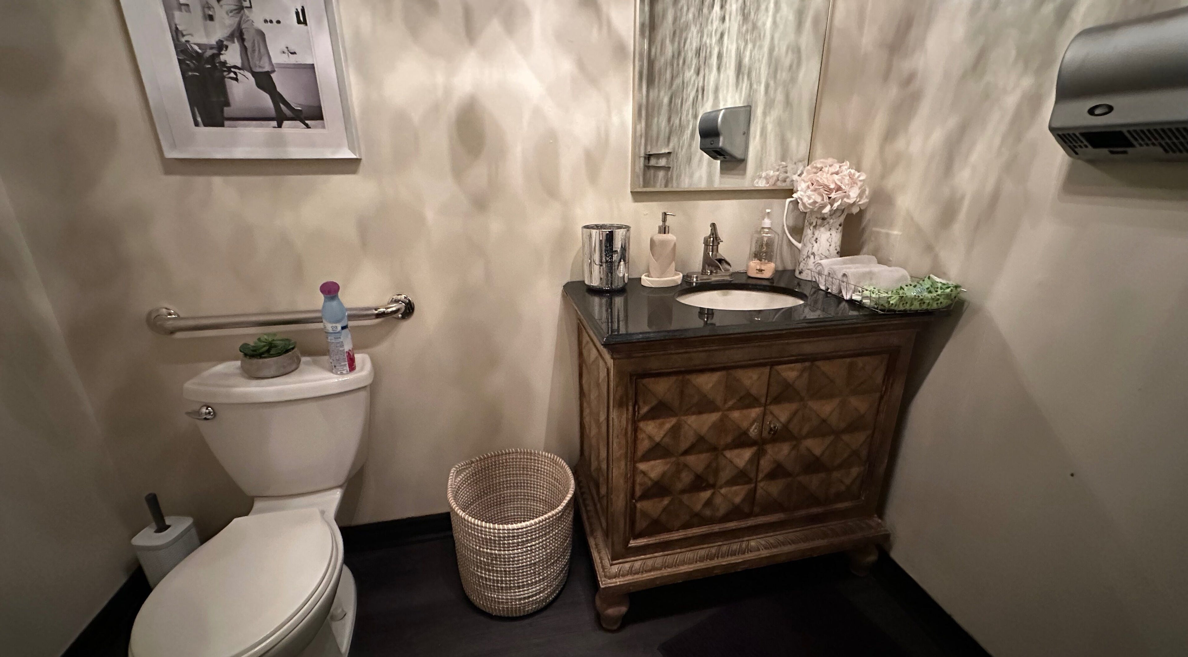 Elegant restroom at Madly In Lashed, Hamilton, Ontario, CA, featuring stylish decor and modern amenities.