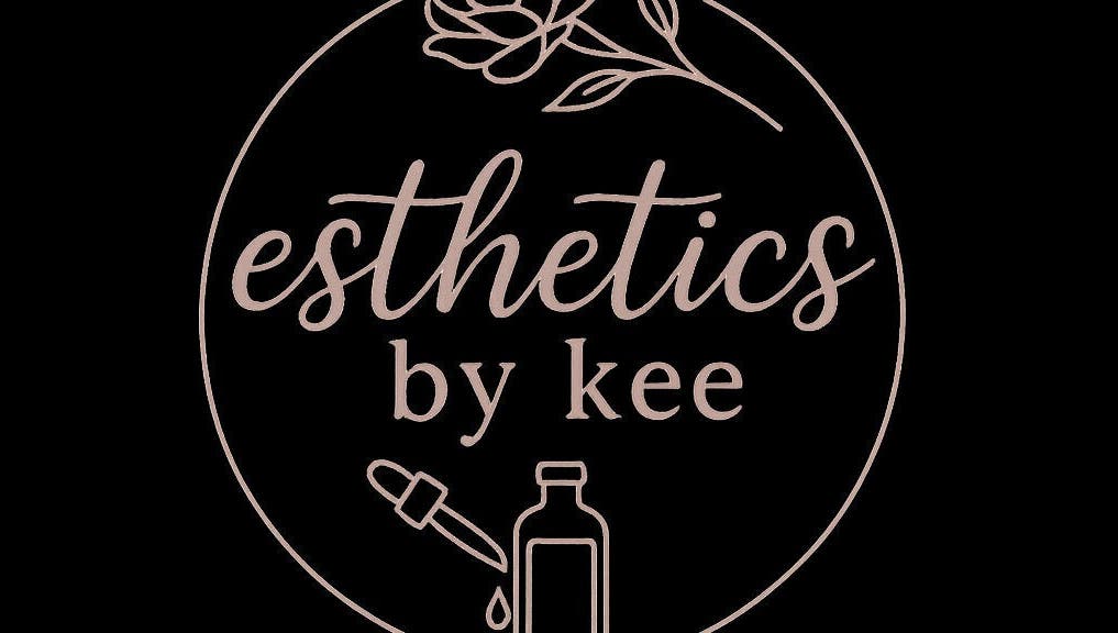 Logo of Esthetics by Kee in Baton Rouge, Louisiana, US featuring elegant script and floral design.