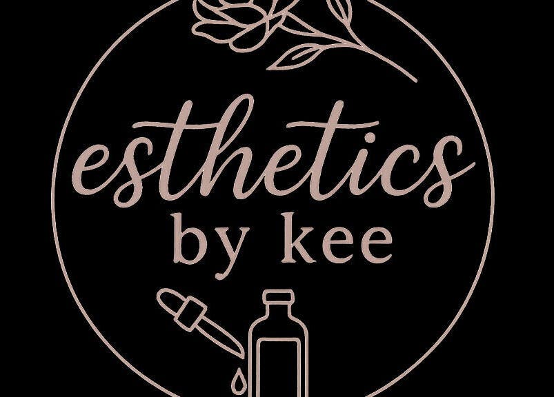 Logo of Esthetics by Kee in Baton Rouge, Louisiana, US featuring elegant script and floral design.