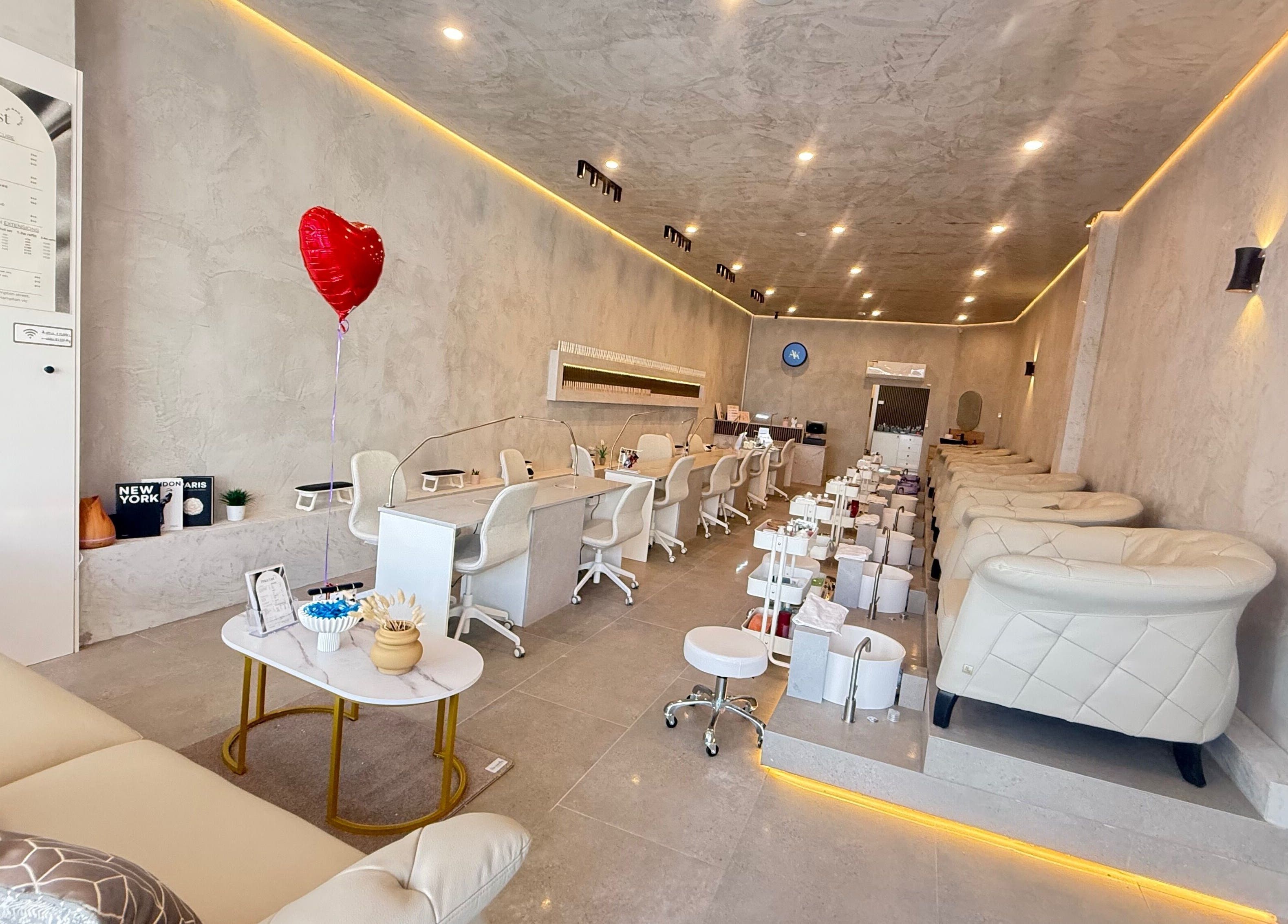 Elegant interior of AK.nails _salon in Melbourne, Victoria, AU with modern design and plush seating for customer comfort.