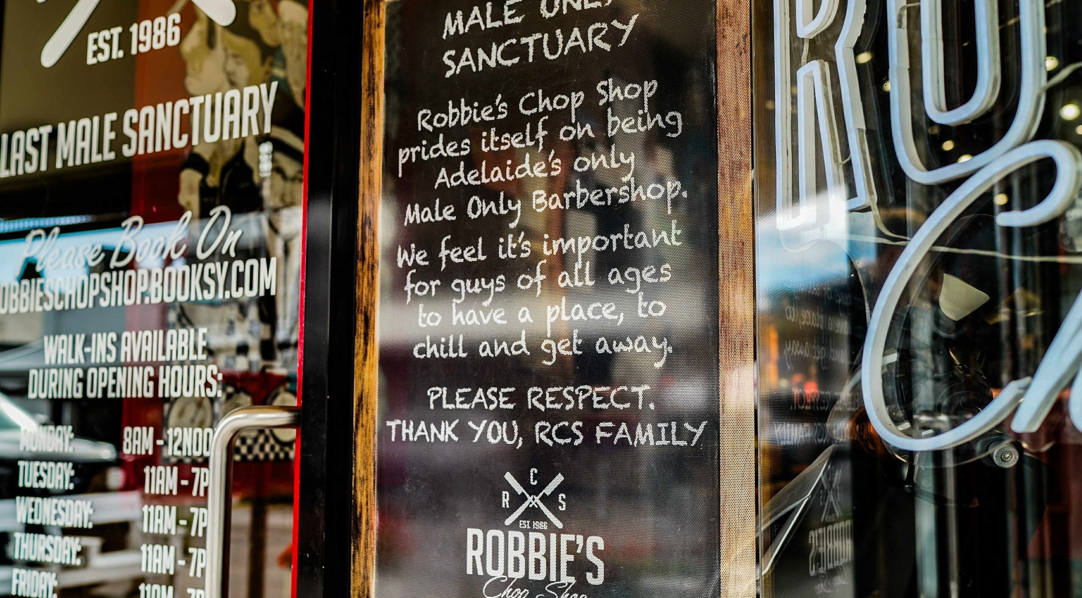 Robbie's Chop Shop in Adelaide, South Australia, AU. Exclusive male-only barbershop entrance sign.