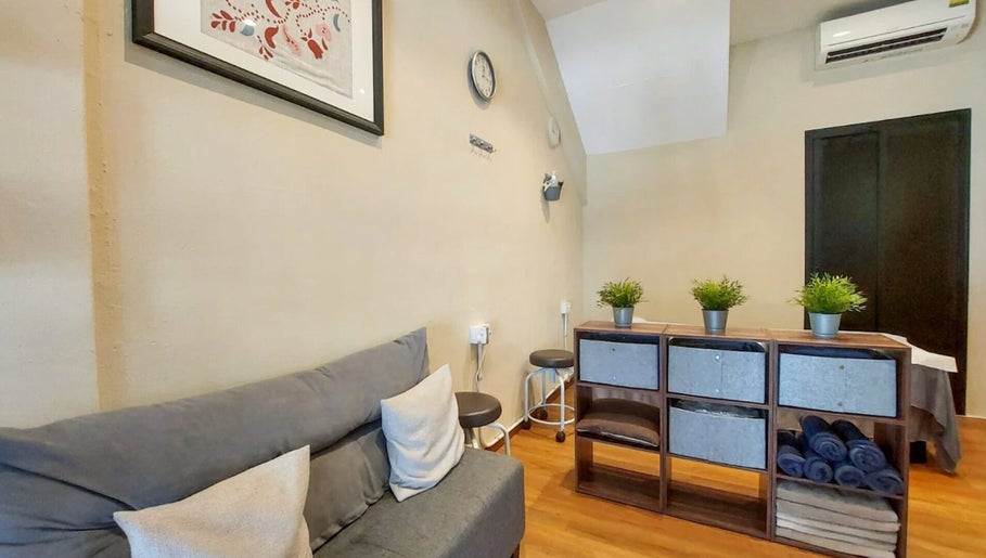 Inviting reception at Zensational Sports Massage Therapy, Singapore, SG with cozy seating and elegant decor.