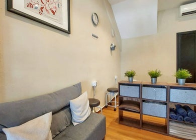 Inviting reception at Zensational Sports Massage Therapy, Singapore, SG with cozy seating and elegant decor.