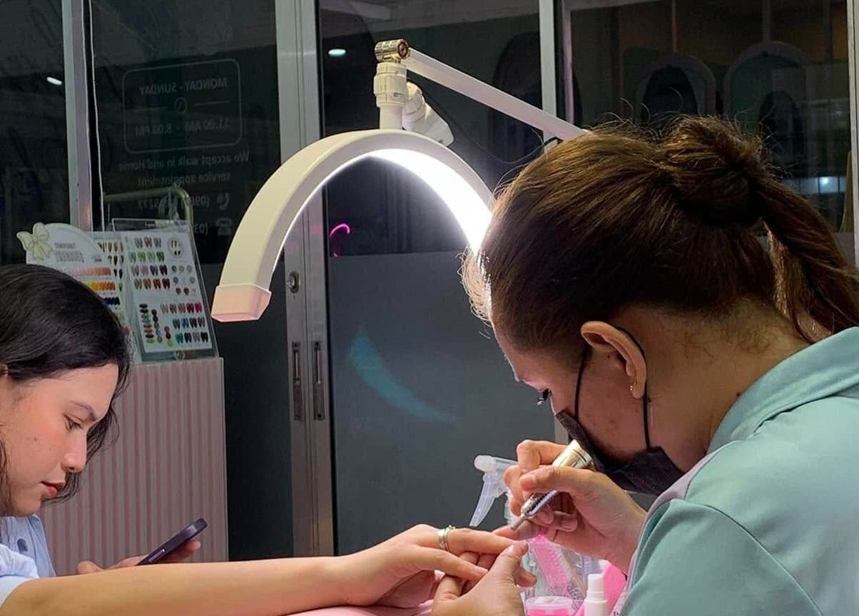 Nail technician crafting intricate designs at All Glammed Up, Cebu City, Central Visayas, PH.
