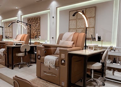 Luxurious pedicure chairs at Lish Hair & Beauty - JBR, Dubai, AE offer comfort and style in a tranquil setting.