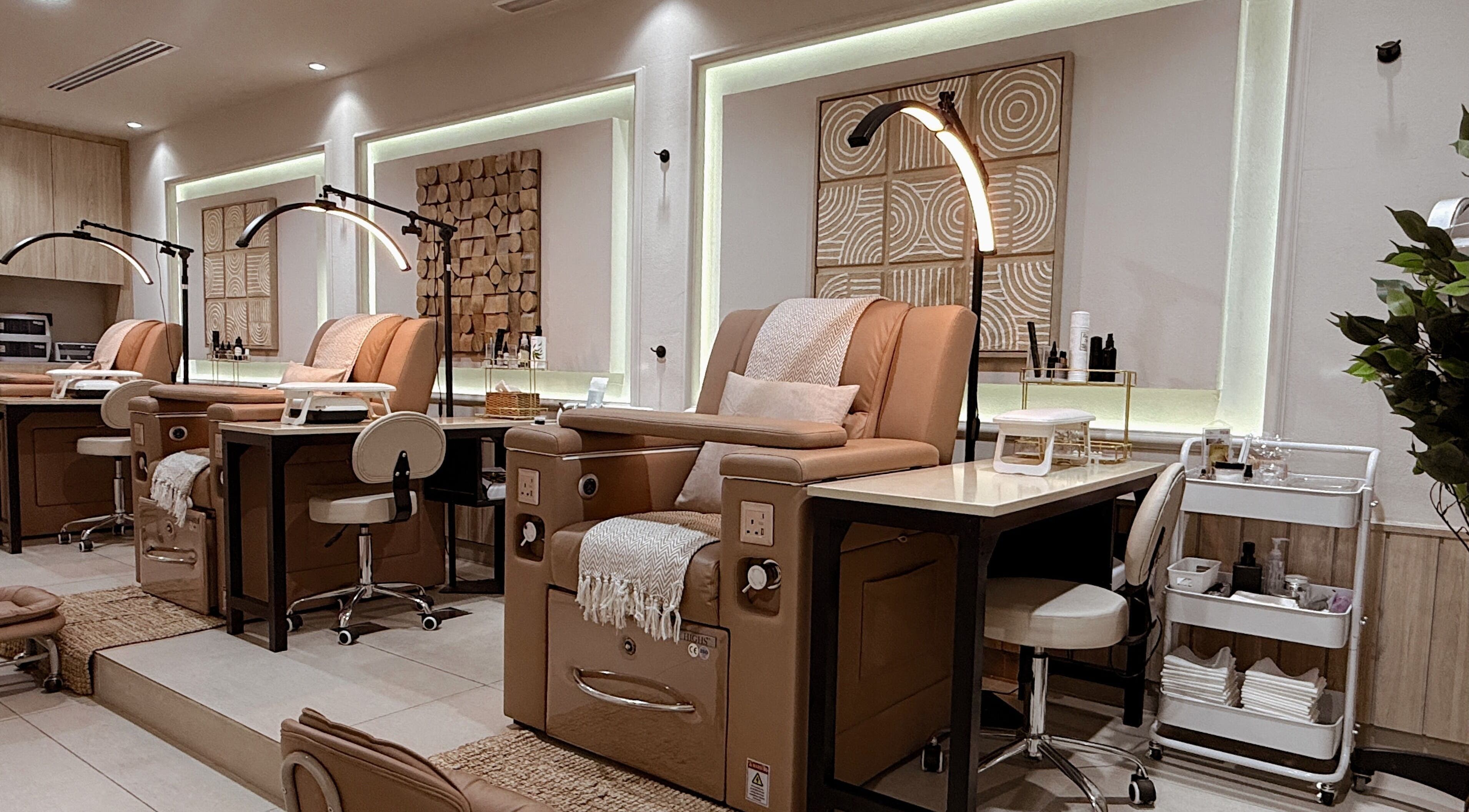Luxurious pedicure chairs at Lish Hair & Beauty - JBR, Dubai, AE offer comfort and style in a tranquil setting.