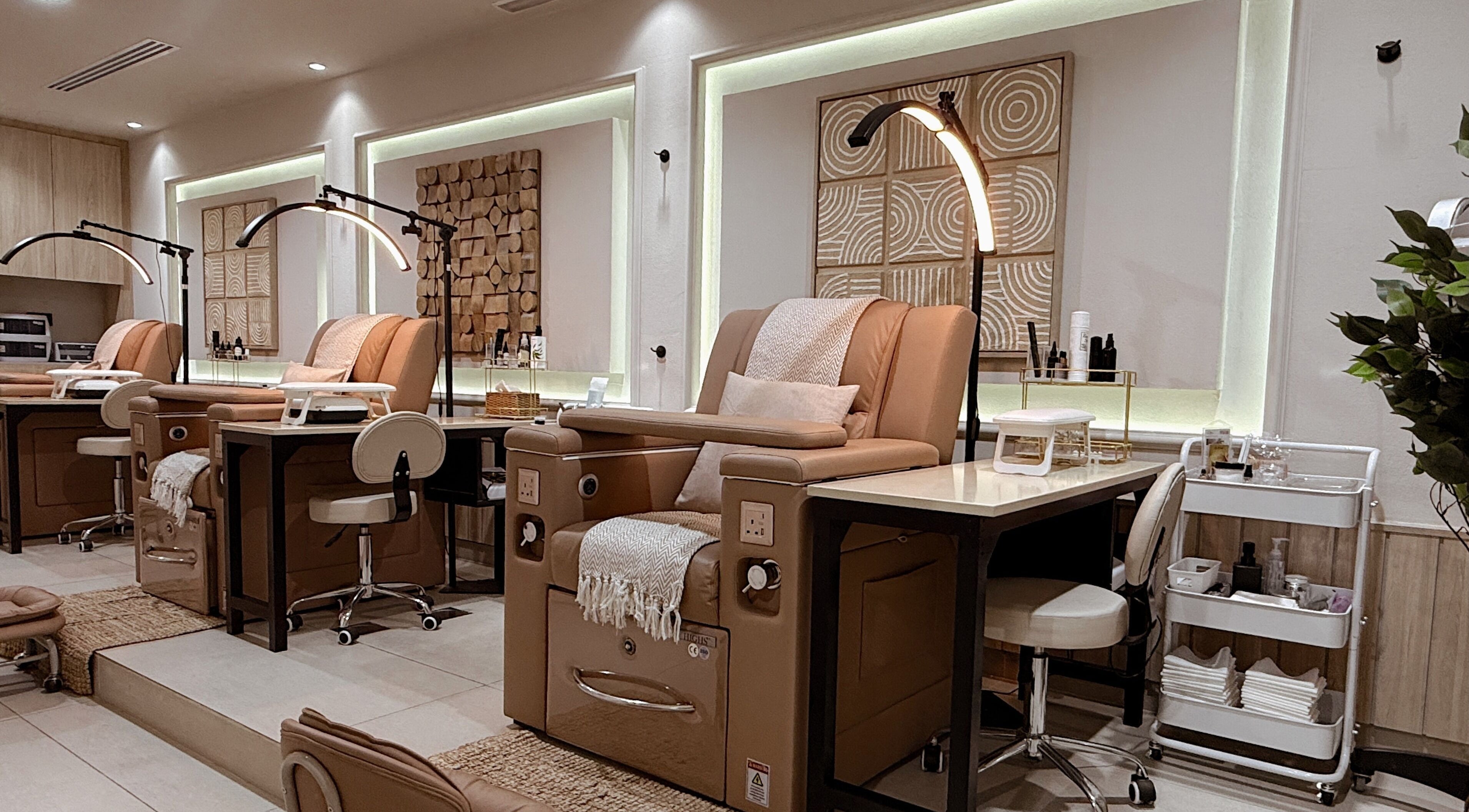 Luxurious pedicure chairs at Lish Hair & Beauty - JBR, Dubai, AE offer comfort and style in a tranquil setting.