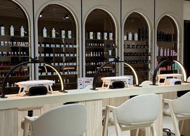 Elegant nail bar at Lish Hair & Beauty - JBR, Dubai, AE with modern decor and nail polish display.