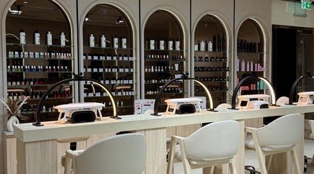 Elegant nail bar at Lish Hair & Beauty - JBR, Dubai, AE with modern decor and nail polish display.