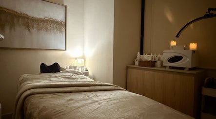 Relaxing treatment room at Lish Hair & Beauty - JBR, Dubai, AE. Cozy bed and soft lighting for ultimate relaxation.