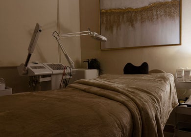 Spa room at Lish Hair & Beauty - JBR, Dubai, AE, with a plush treatment bed and ambient lighting.