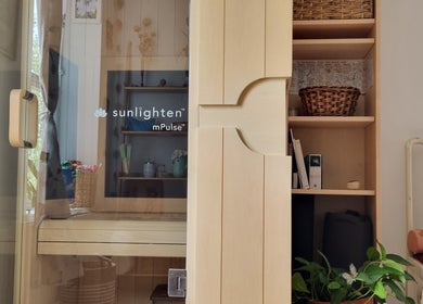 Ochroma home Sauna in Brighton And Hove, England, GB offers a cozy wooden interior with shelving decoration.