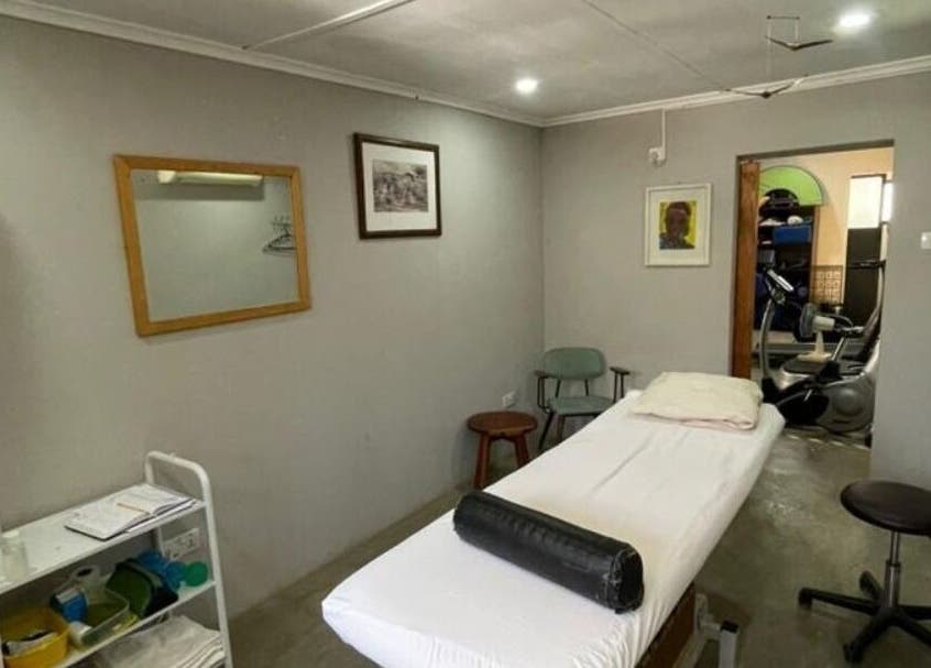 Cozy therapy room at Dynamic Physical Therapy -Town Center, Lusaka, Zambia, featuring a massage table and calm decor.