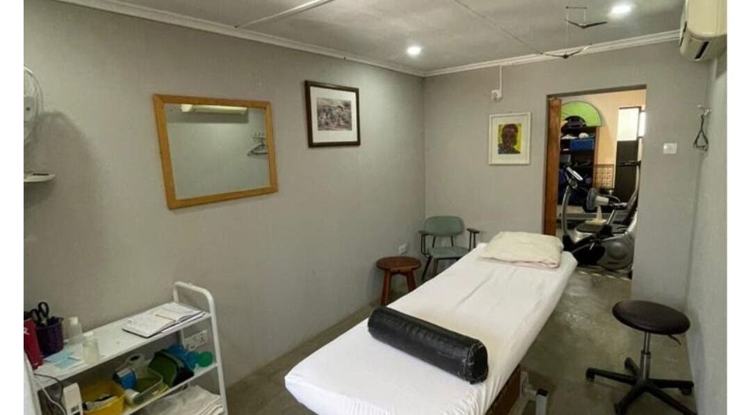 Cozy therapy room at Dynamic Physical Therapy -Town Center, Lusaka, Zambia, featuring a massage table and calm decor.