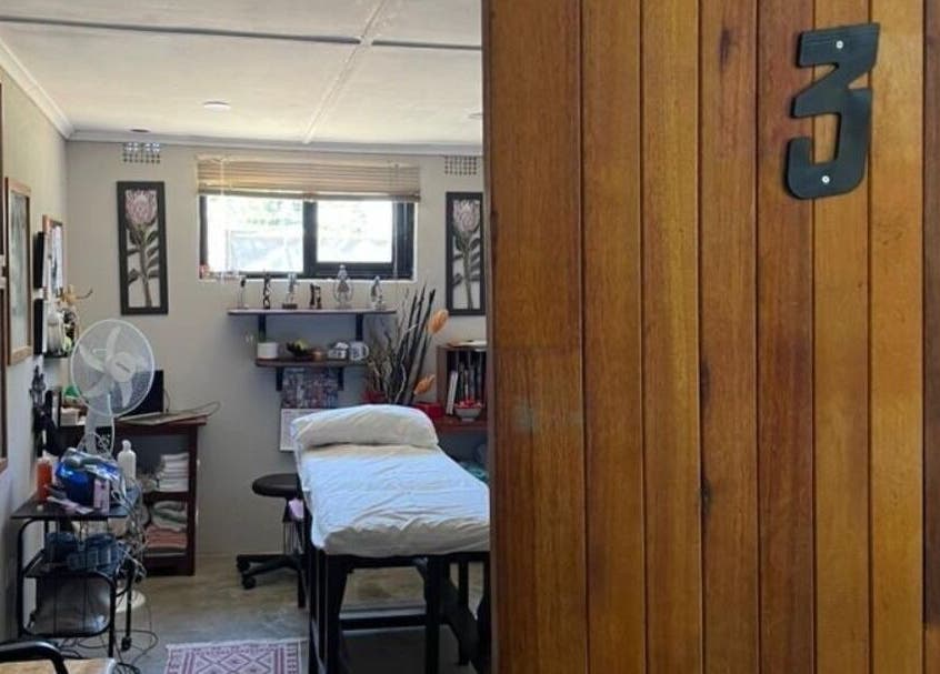 Therapy room at Dynamic Physical Therapy - Town Center, Lusaka, Lusaka Province, ZM with a wooden door entrance.
