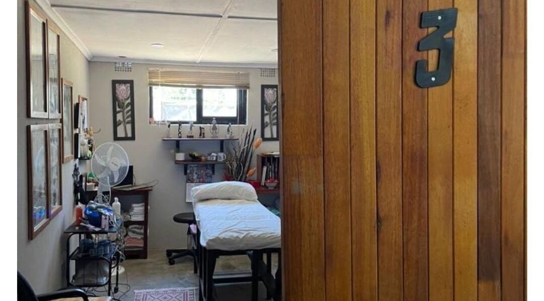 Therapy room at Dynamic Physical Therapy - Town Center, Lusaka, Lusaka Province, ZM with a wooden door entrance.