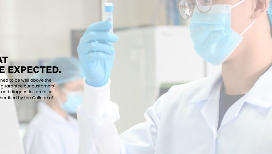 Lab technician in SGD Pasig, Metro Manila, PH, wearing safety gear performs precise diagnostics.